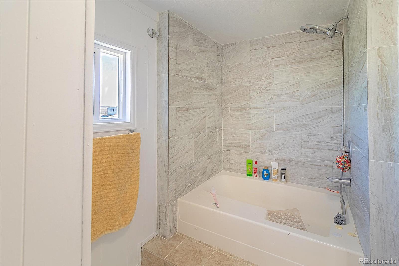 3415 Wiesner Road Calhan, CO 80808 - Photo 15 of 33 a bathroom with a bathtub