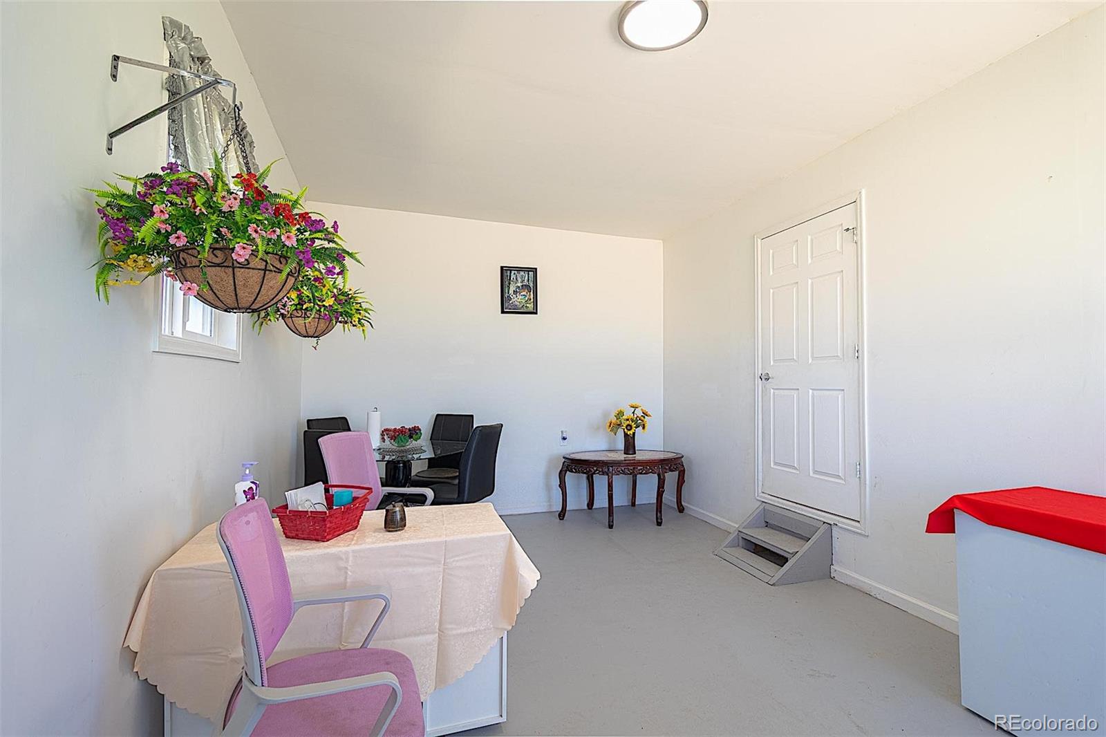 3415 Wiesner Road Calhan, CO 80808 - Photo 16 of 33 a living room with furniture and a potted plant