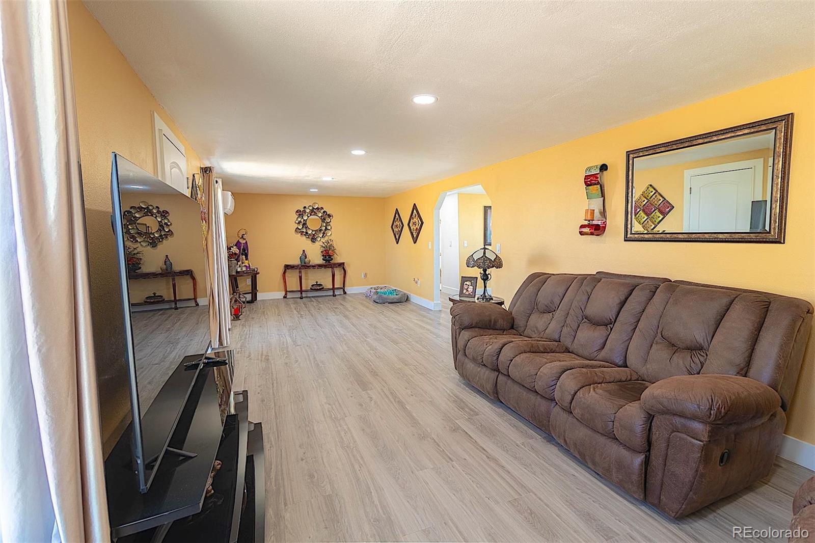 3415 Wiesner Road Calhan, CO 80808 - Photo 27 of 33 a living room with furniture and a flat screen tv
