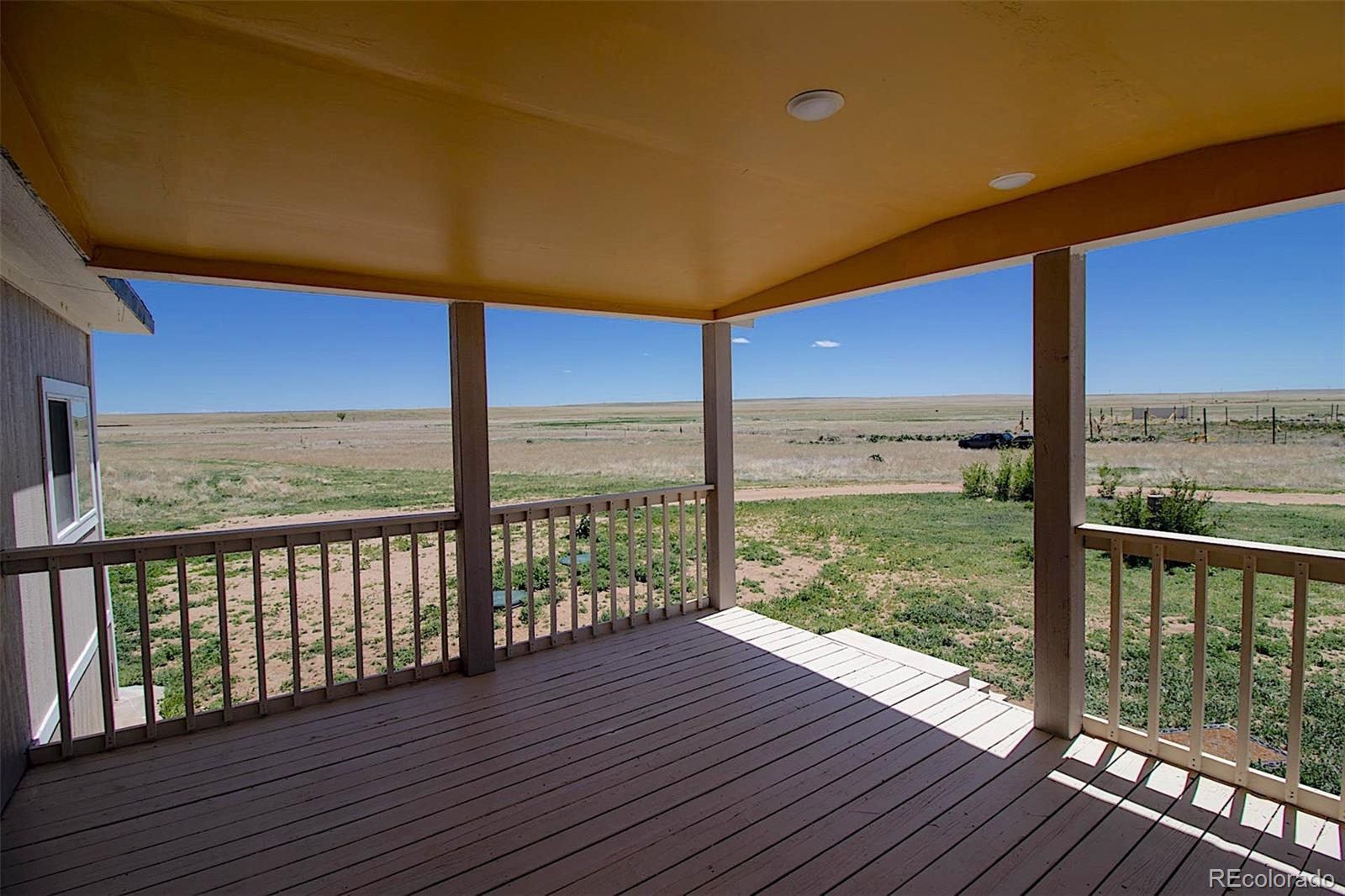 3415 Wiesner Road Calhan, CO 80808 - Photo 3 of 33 a view of a city from a balcony