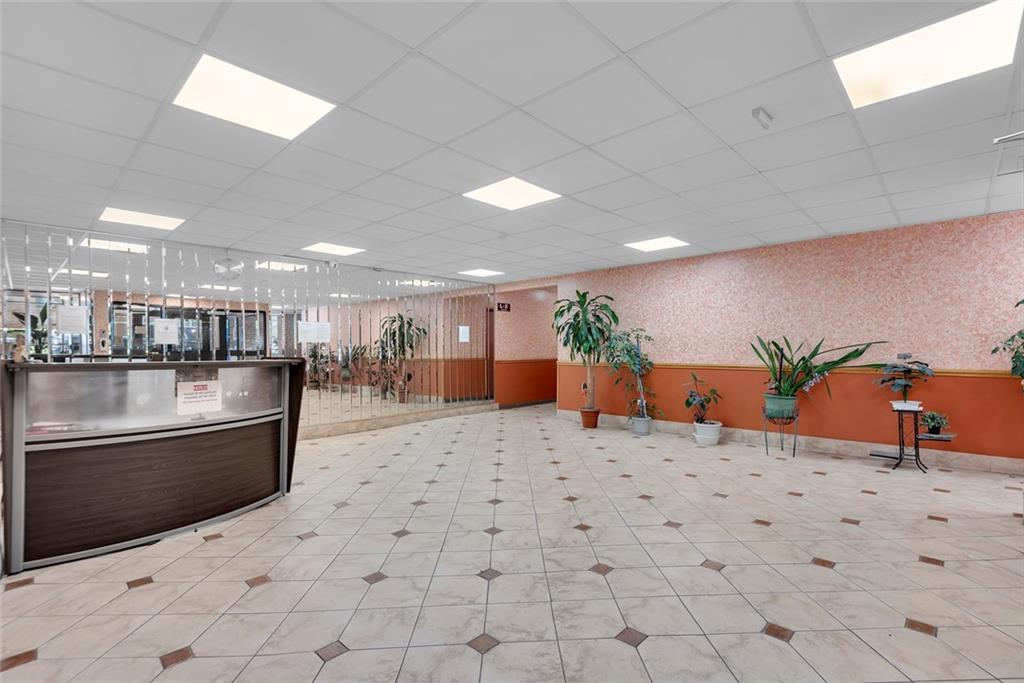 2626 Homecrest Avenue, Unit 3L Brooklyn, NY 11235 - Photo 6 of 8 a lobby with a couch and a potted plant