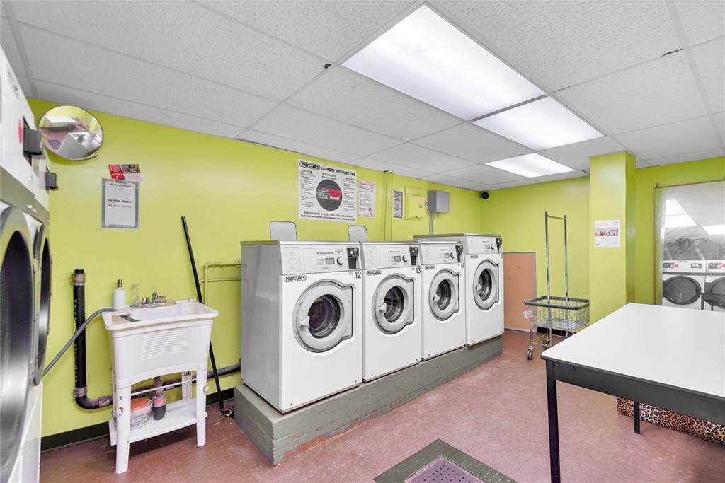 2626 Homecrest Avenue, Unit 3L Brooklyn, NY 11235 - Photo 7 of 8 a utility room with dryer and washer