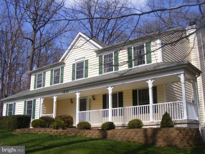 1219 Providence Road Towson, MD 21286 - Photo 1 of 27 a front view of a house with a yard