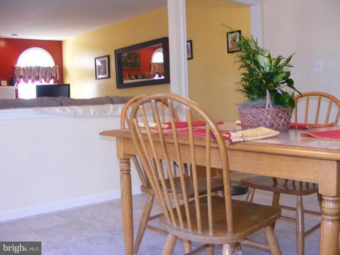 1219 Providence Road Towson, MD 21286 - Photo 2 of 27 a view of a dining room with furniture window and wooden floor