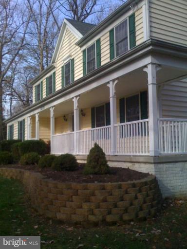 1219 Providence Road Towson, MD 21286 - Photo 11 of 27 a front view of a house with a yard