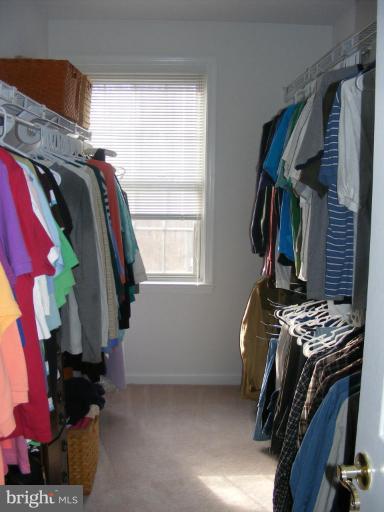 1219 Providence Road Towson, MD 21286 - Photo 14 of 27 a view of walk in closet with clothes and shoes