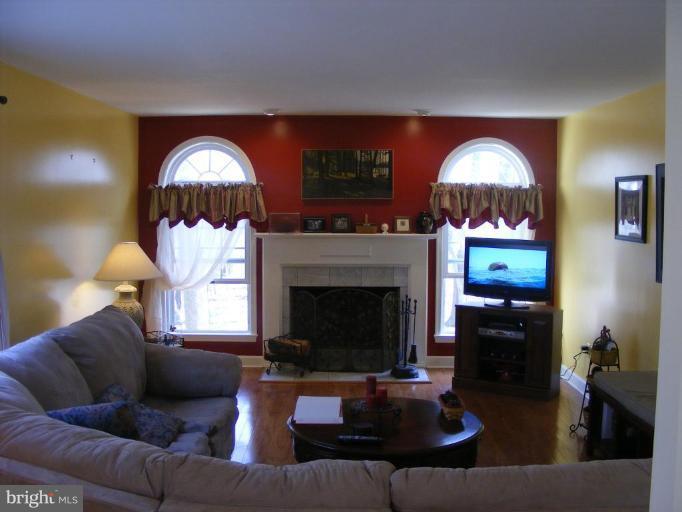 1219 Providence Road Towson, MD 21286 - Photo 3 of 27 a living room with furniture and a fireplace