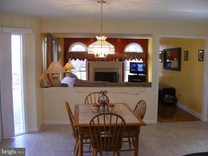 1219 Providence Road Towson, MD 21286 - Photo 27 of 27 a view of a dining room with furniture and a chandelier