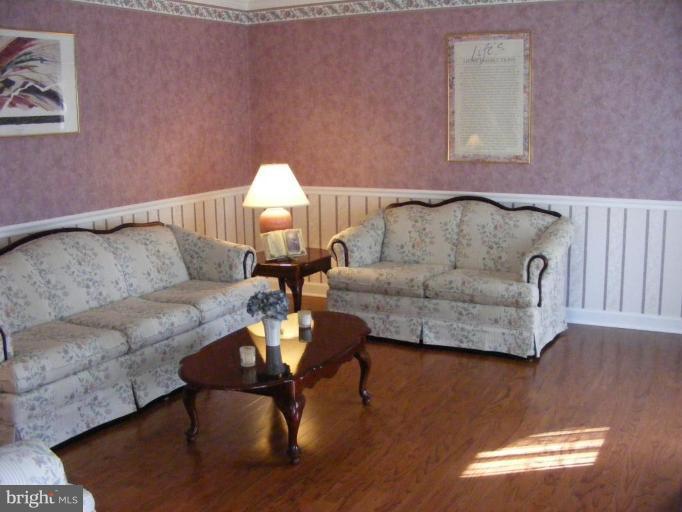1219 Providence Road Towson, MD 21286 - Photo 5 of 27 a living room with furniture and a couch