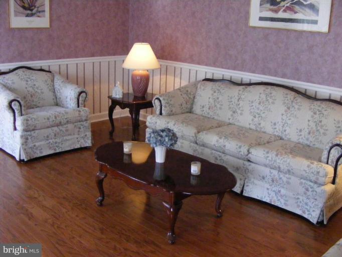 1219 Providence Road Towson, MD 21286 - Photo 6 of 27 a living room with furniture and a wooden floor