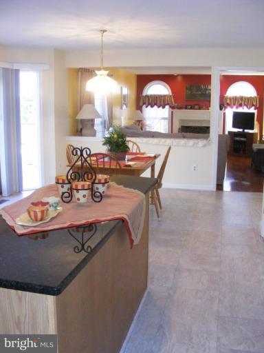 1219 Providence Road Towson, MD 21286 - Photo 7 of 27 a dining room with a table and chairs in it