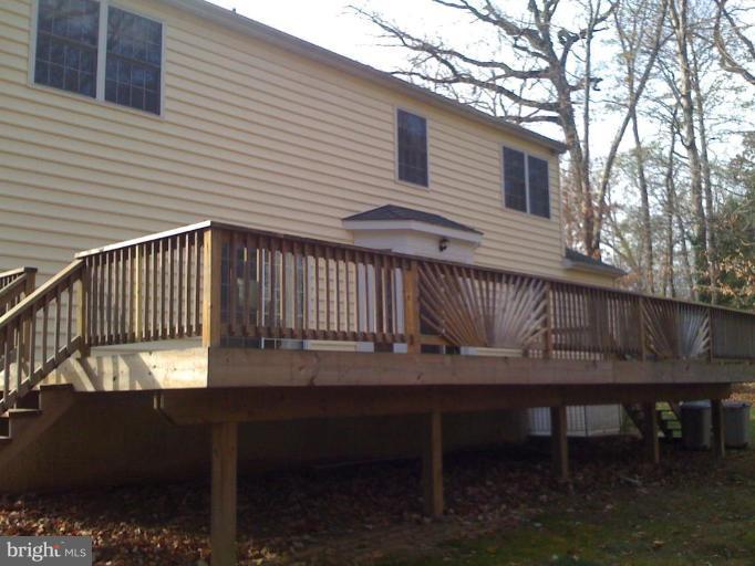 1219 Providence Road Towson, MD 21286 - Photo 10 of 27 a view of a wooden bench and chair in the balcony