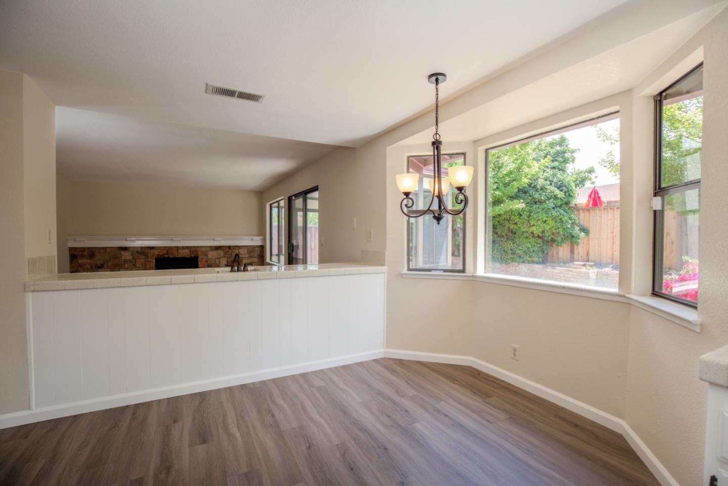 2774 Boncheff Drive San Jose, CA 95133 - Photo 14 of 38 a view of a kitchen with wooden floor and outdoor space