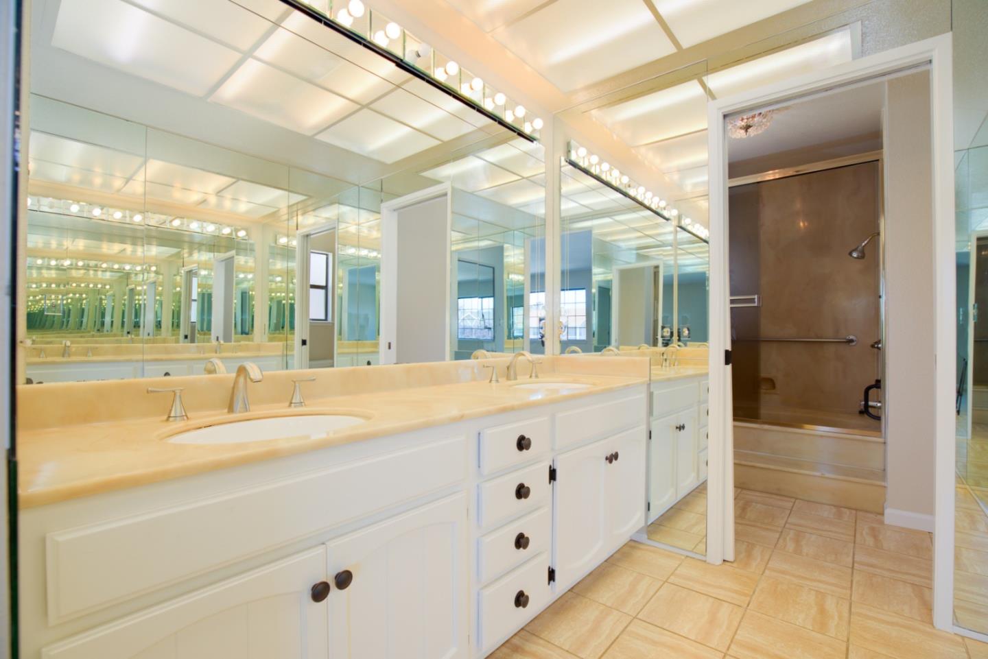 2774 Boncheff Drive San Jose, CA 95133 - Photo 25 of 38 a bathroom with a tub and a sink mirror next to a window