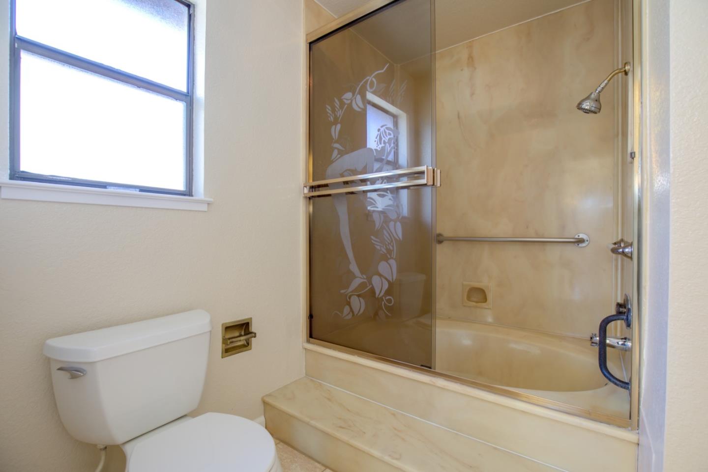 2774 Boncheff Drive San Jose, CA 95133 - Photo 26 of 38 a bathroom with a toilet and a shower
