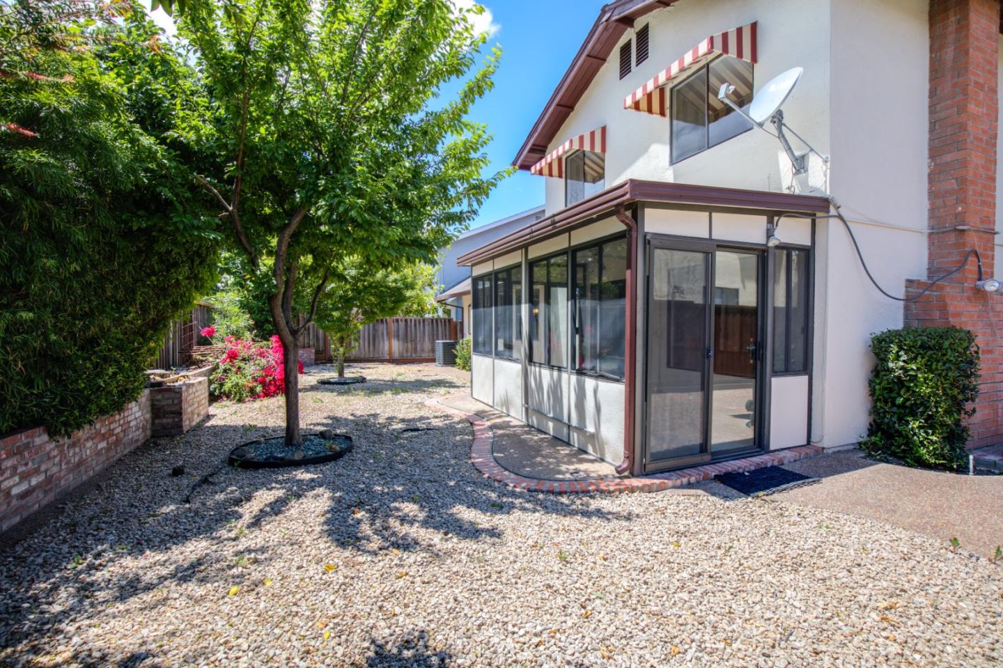 2774 Boncheff Drive San Jose, CA 95133 - Photo 36 of 38 a view of a small house with a small yard and large tree