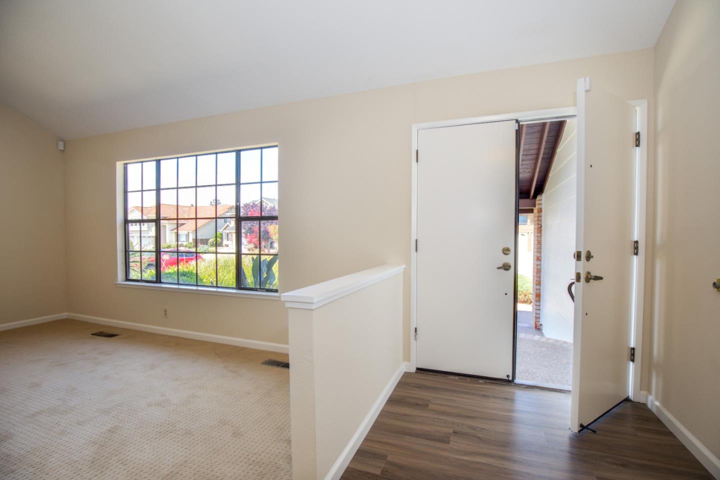 2774 Boncheff Drive San Jose, CA 95133 - Photo 4 of 38 an empty room with wooden floor and windows