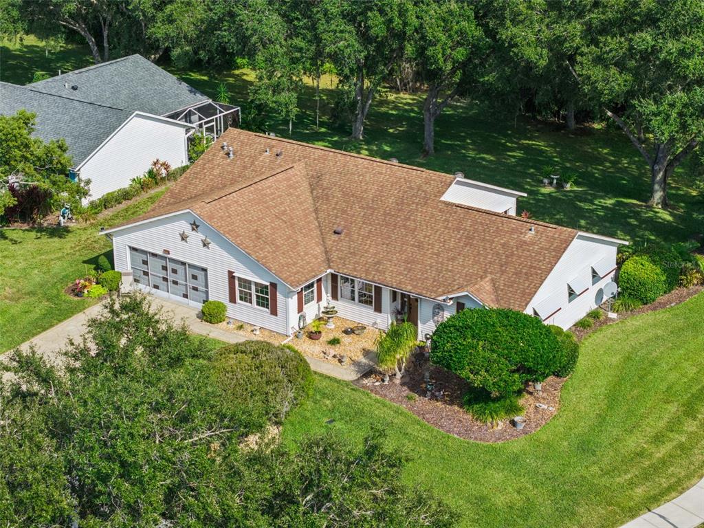 26600 Racquet Circle Leesburg, FL 34748 - Photo 2 of 80 an aerial view of a house with a garden