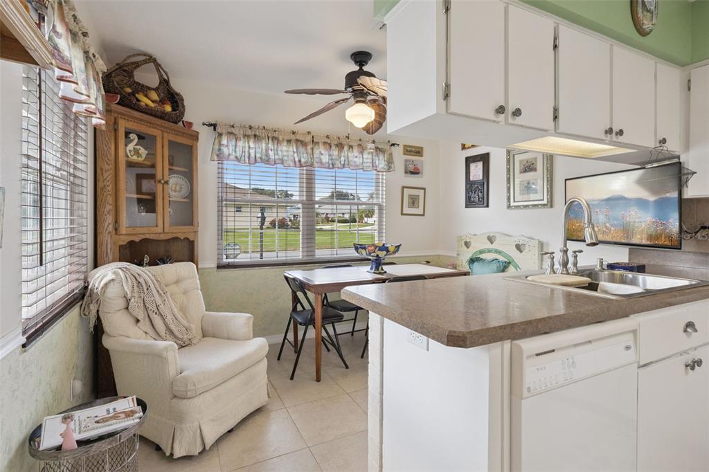 26600 Racquet Circle Leesburg, FL 34748 - Photo 25 of 80 a kitchen with a stove a sink and a refrigerator