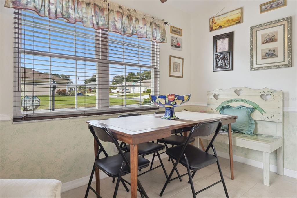 26600 Racquet Circle Leesburg, FL 34748 - Photo 27 of 80 a view of a dining room with furniture and window