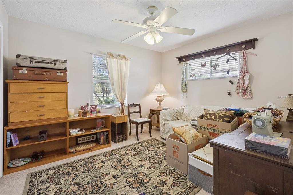 26600 Racquet Circle Leesburg, FL 34748 - Photo 33 of 80 a living room with furniture