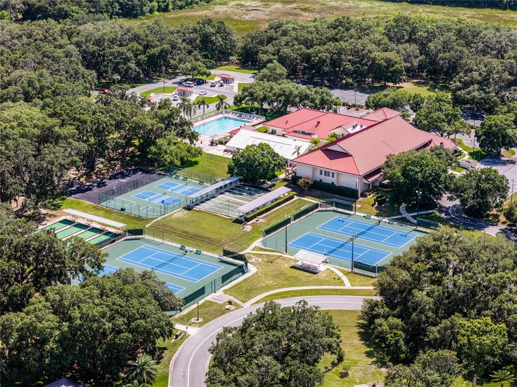 26600 Racquet Circle Leesburg, FL 34748 - Photo 42 of 80 an aerial view of residential houses with outdoor space