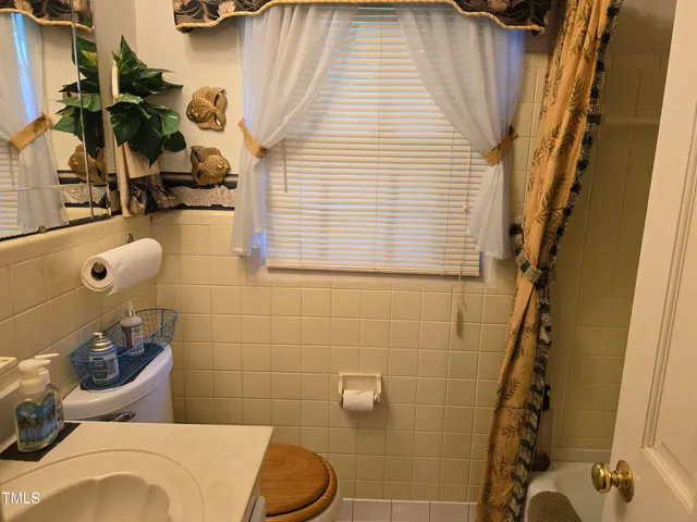 a bathroom with a sink and toilet