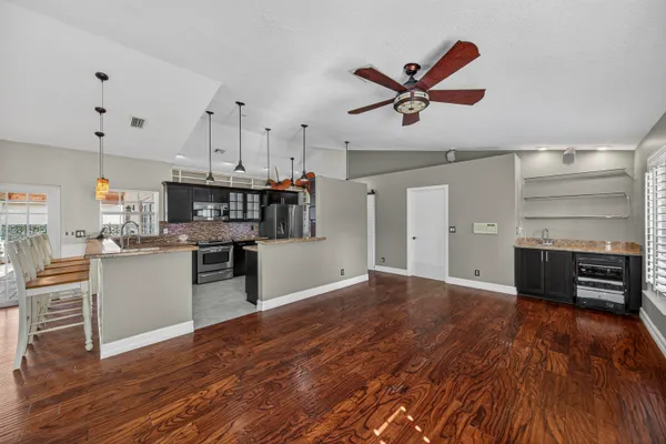 a view of kitchen and wooden floor