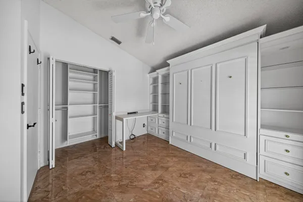 a view of empty room with cabinet and cabinet