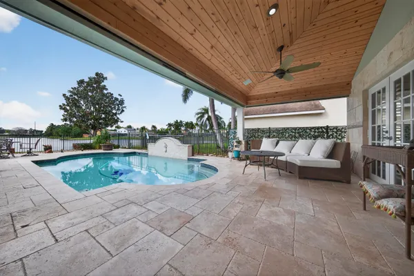a view of swimming pool with seating space
