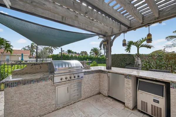 a open kitchen with a sink and dishwasher with a outdoor space