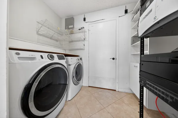 a view of a storage & utility room with washer and dryer
