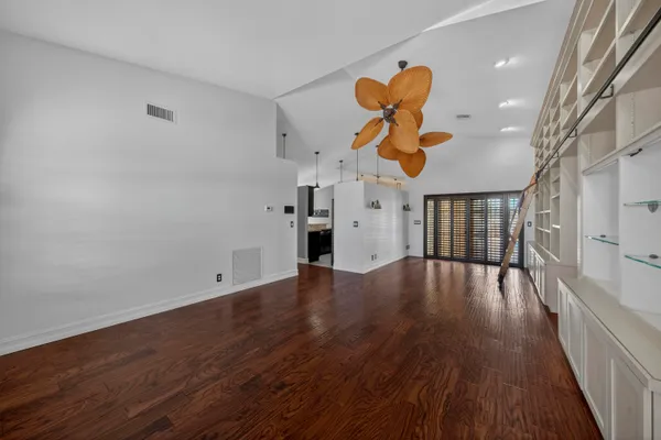a view of an entryway with wooden floor