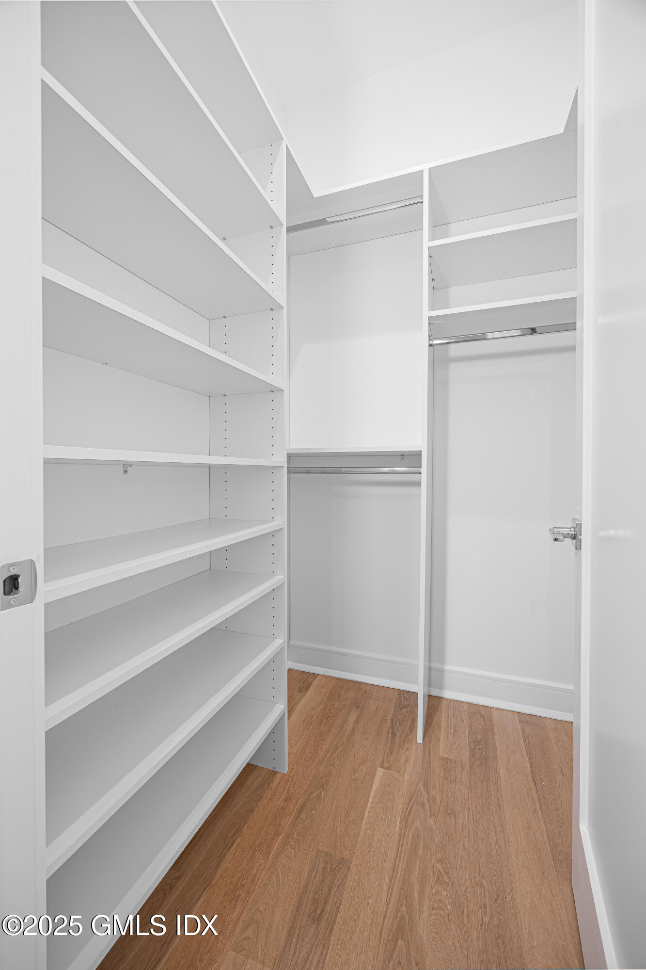 82 Josephine Evaristo Avenue Greenwich, CT 06830 - Photo 13 of 13 a view of walk in closet with empty racks