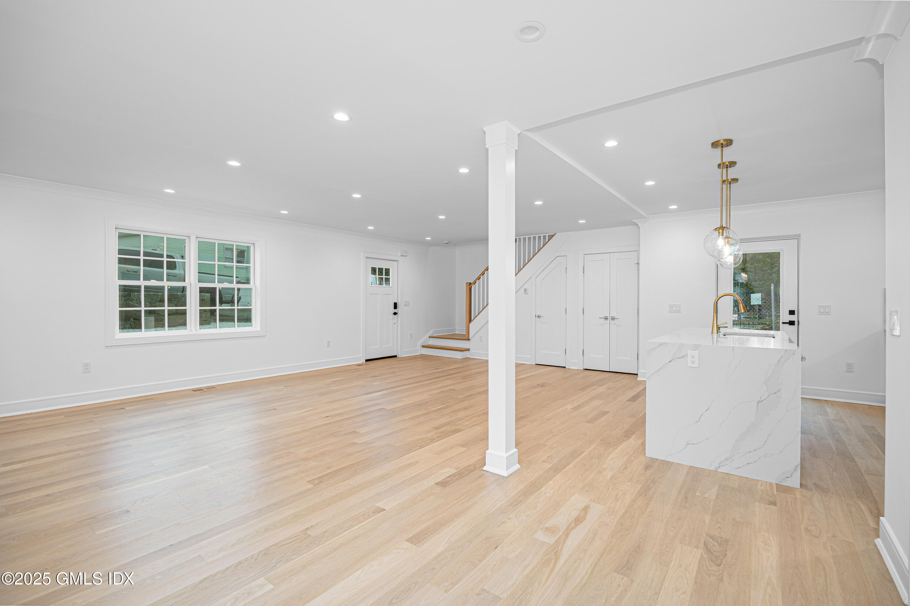 82 Josephine Evaristo Avenue Greenwich, CT 06830 - Photo 6 of 13 a view of an empty room with wooden floor and a window