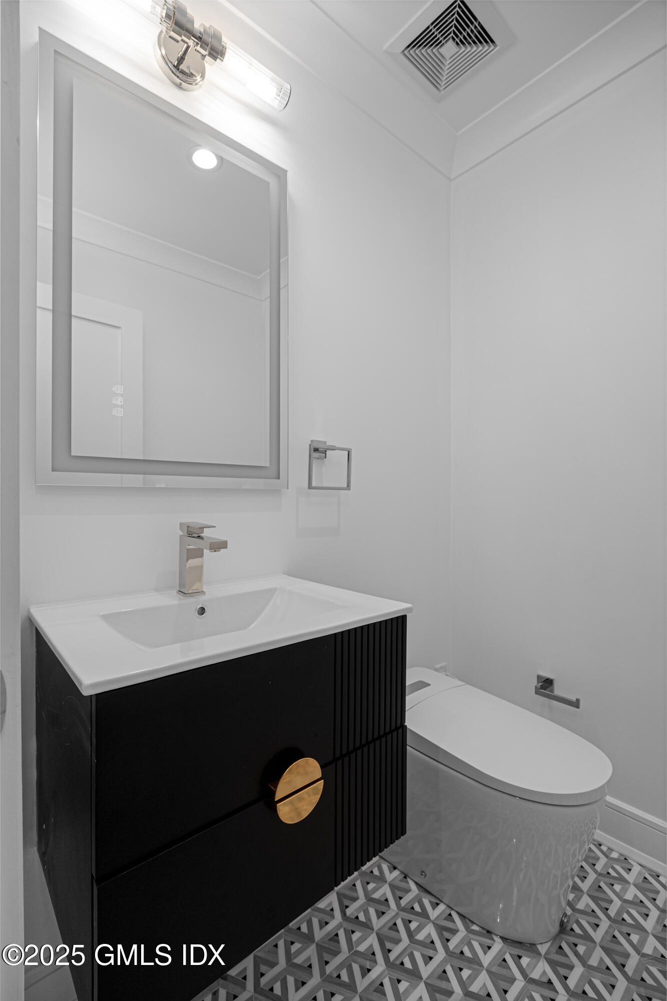 82 Josephine Evaristo Avenue Greenwich, CT 06830 - Photo 7 of 13 a bathroom with a sink toilet and mirror