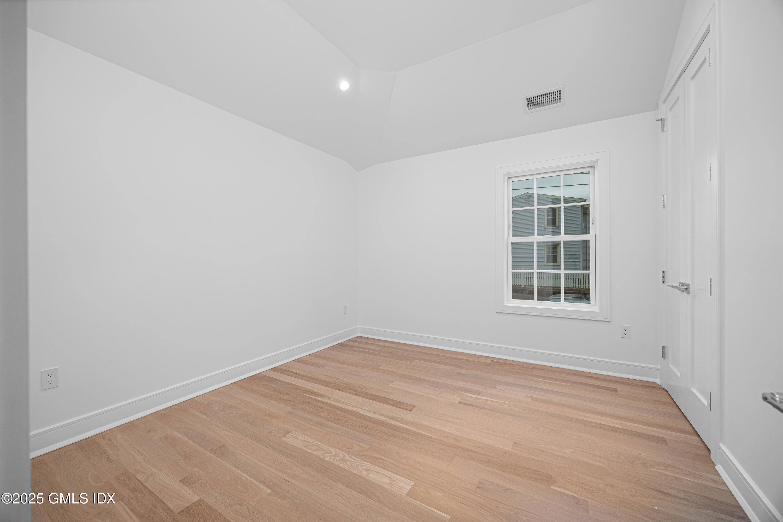 82 Josephine Evaristo Avenue Greenwich, CT 06830 - Photo 9 of 13 an empty room with windows