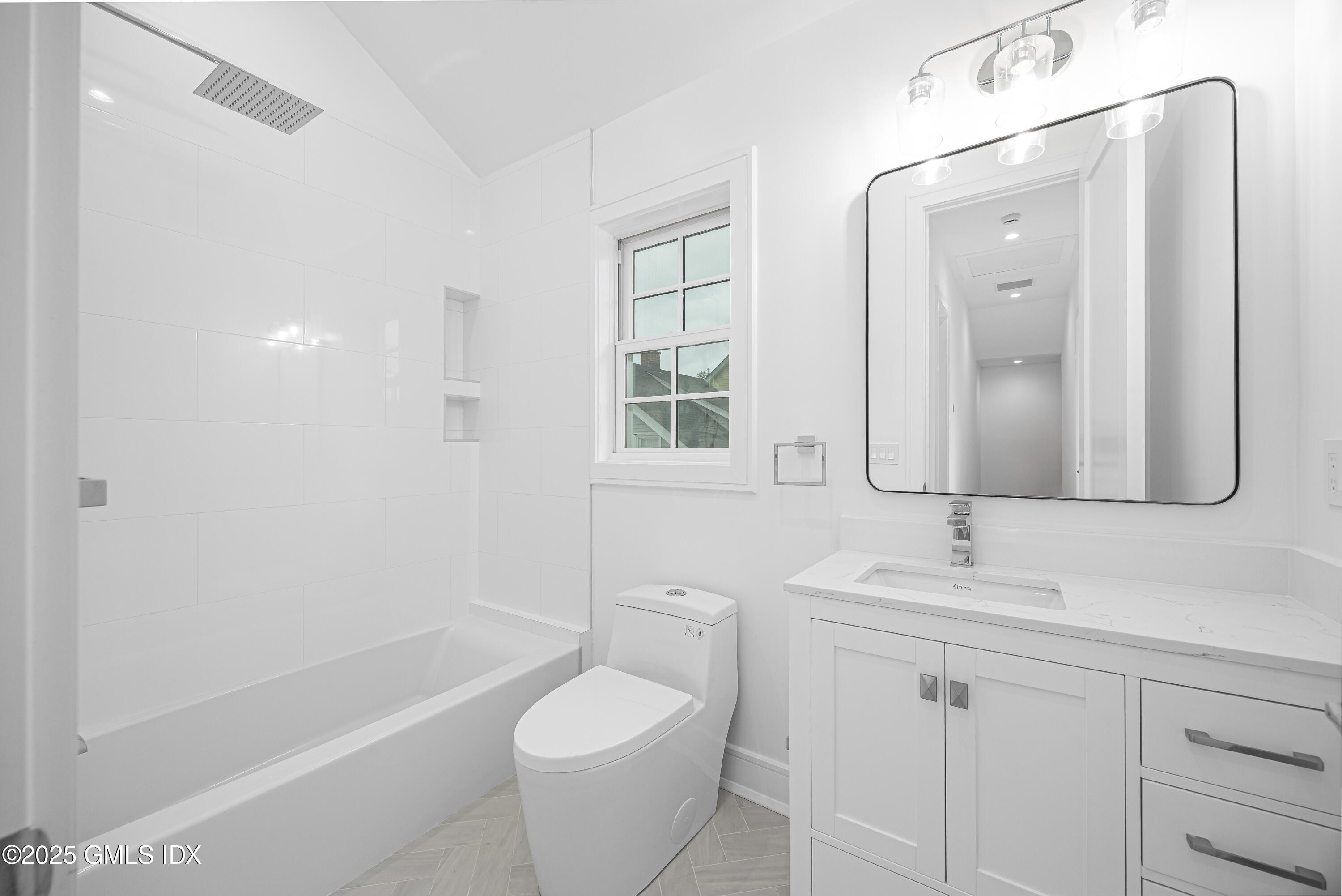 82 Josephine Evaristo Avenue Greenwich, CT 06830 - Photo 10 of 13 a bathroom with a double vanity sink a toilet and shower