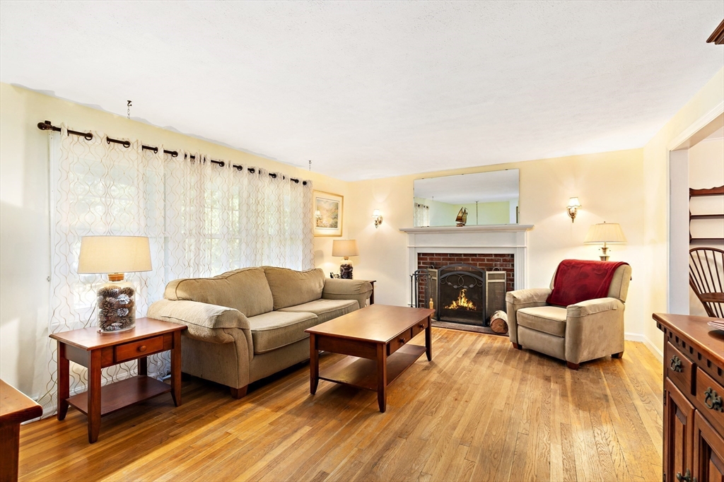 102 Turtleback Road Barnstable, MA 02648 - Photo 3 of 20 a living room with furniture and a fireplace