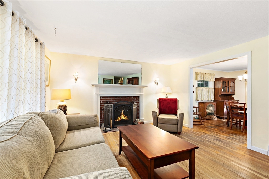 102 Turtleback Road Barnstable, MA 02648 - Photo 4 of 20 a living room with furniture and a fireplace
