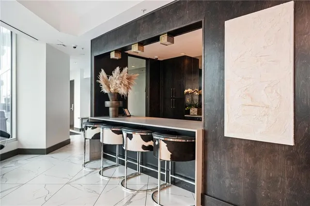 a view of a room with wooden floor and windows