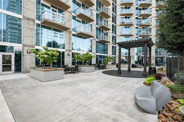 a view of a building with sitting area