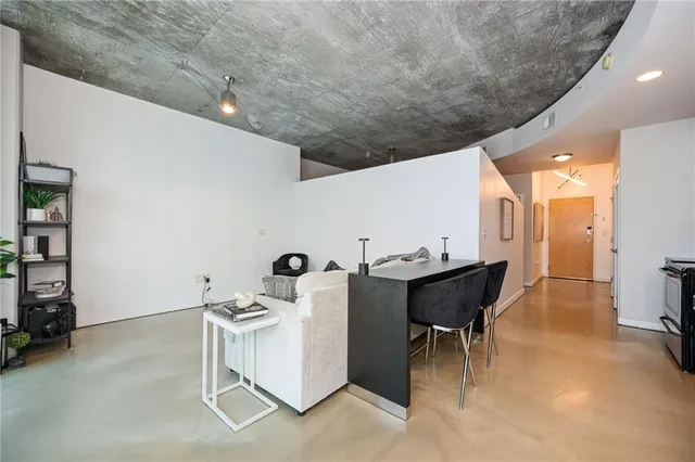 a living room with furniture and a table