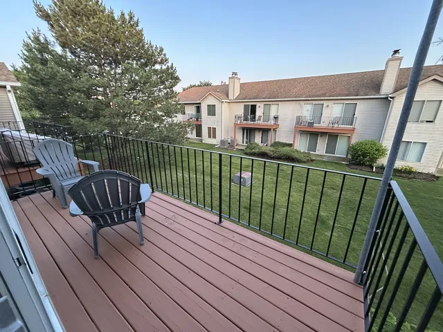 a view of balcony with furniture