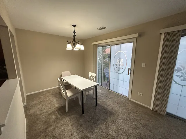 a workspace room with furniture and window