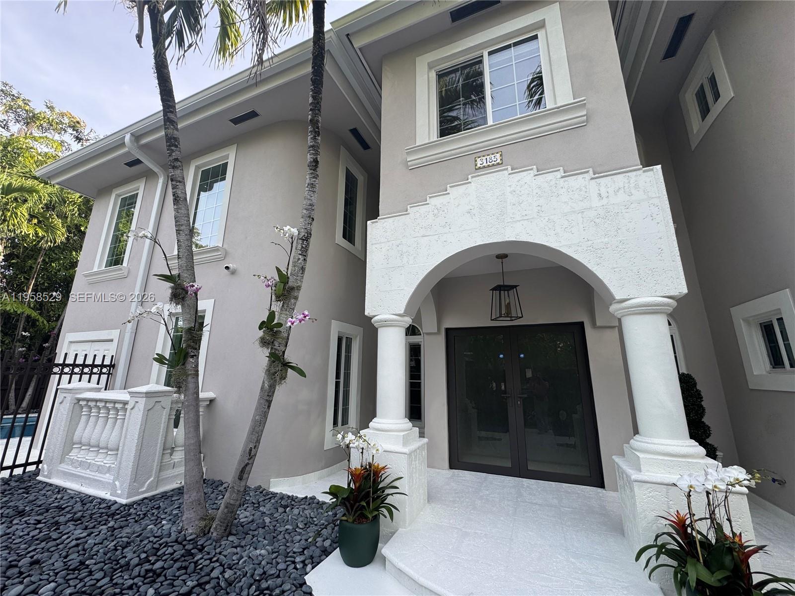 3185 Washington Street Miami, FL 33133 - Photo 1 of 1 a front view of a house with a yard