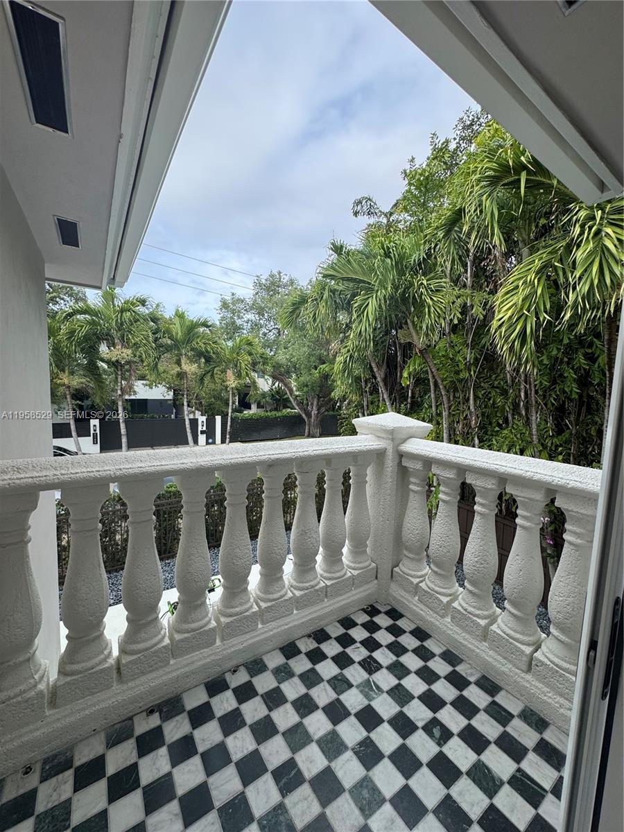 3185 Washington Street Miami, FL 33133 - Photo 19 of 48 a view of balcony with wooden floor
