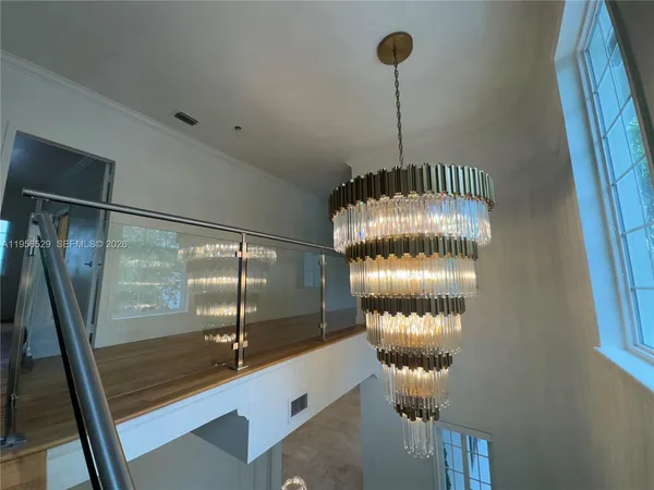 a bathroom with a sink and glass door
