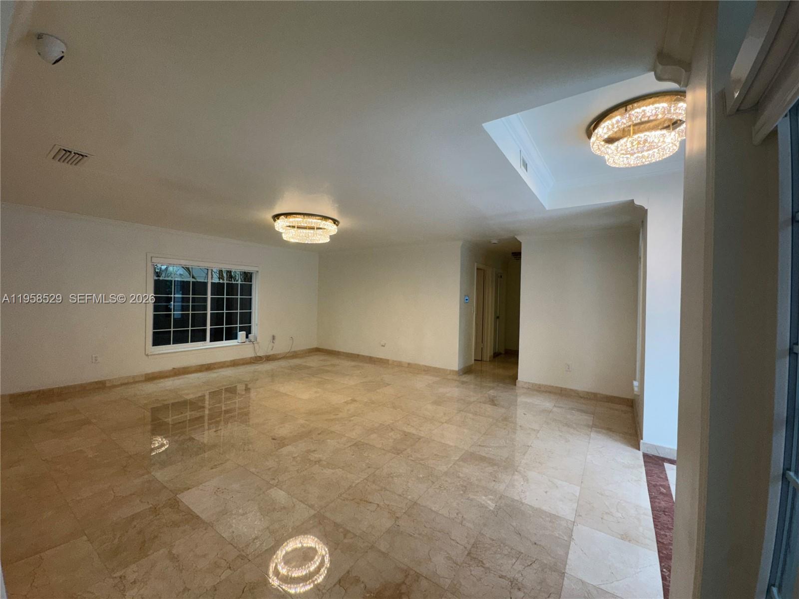 3185 Washington Street Miami, FL 33133 - Photo 26 of 48 a view of an empty room with a window