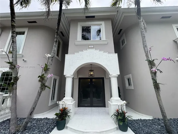 a front view of a house with a white door